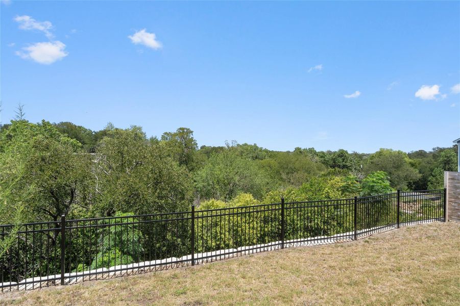 Perched above the tree line, this expansive yard offers scenic views of the surrounding natural landscape. Perched above the tree line, this expansive yard offers scenic views of the surrounding natural landscape.