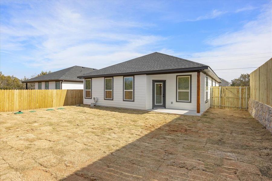 Rear view of house with a patio area