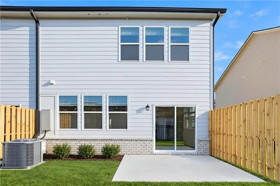 Exterior details and patio area of a home in Towns at Holly Springs, Holly Springs (Image 19).