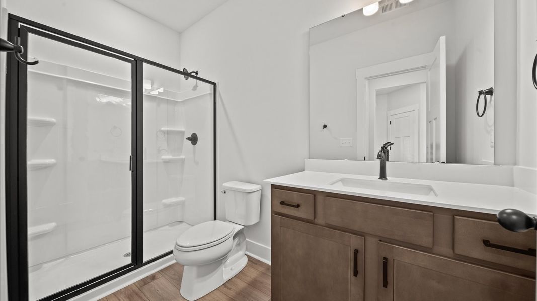 Elegant full bathroom with tasteful finishes and a thoughtfully designed layout