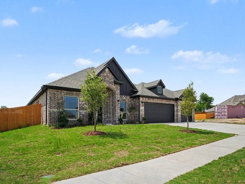 Front exterior of a new home in Cole Crossing Estates, DeSoto, TX, highlighting curb appeal (Image 19). Front exterior of a new home in Cole Crossing Estates, DeSoto, TX, highlighting curb appeal (Image 19).