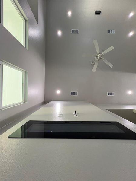 Garage featuring concrete driveway Garage featuring concrete driveway