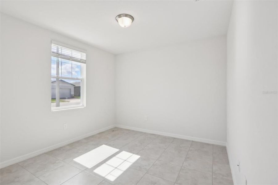 Spacious, unfurnished interior of a new home in Lake Deer Estates - Signature Series, Poinciana (Image 33).