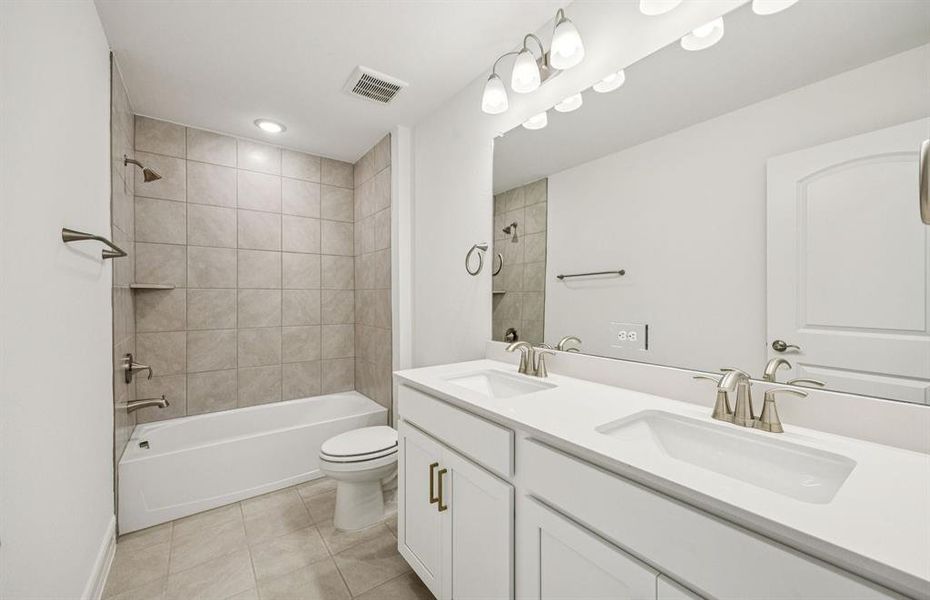 Upgraded secondary bath with elegant finishes *Real home pictured Upgraded secondary bath with elegant finishes *Real home pictured