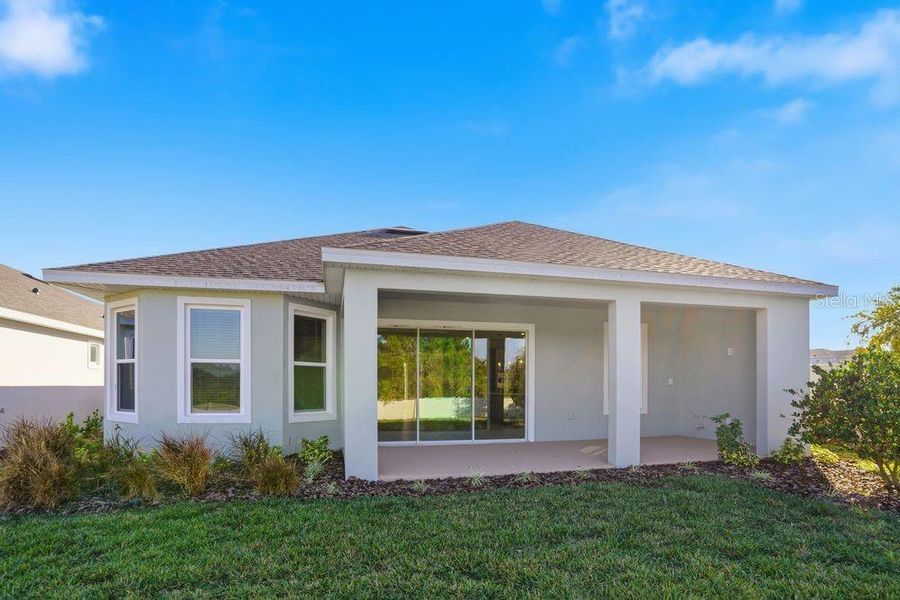 Exterior details and patio area of a home in Esplanade at Center Lake Ranch, St. Cloud (Image 4).