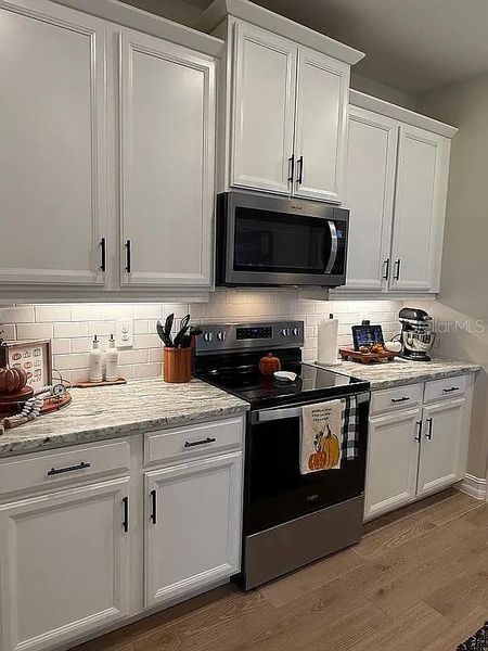 Furnished interior view inside a new home in , Port Charlotte (Image 7). Furnished interior view inside a new home in , Port Charlotte (Image 7).