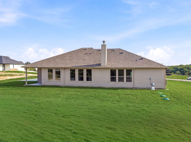 Exterior details and patio area of a home in Saddleback Estates, Boyd (Image 28).