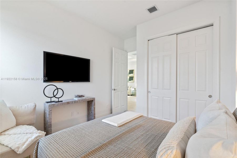 Furnished interior view inside a new home in PGA Village Verano, Port St. Lucie (Image 9).