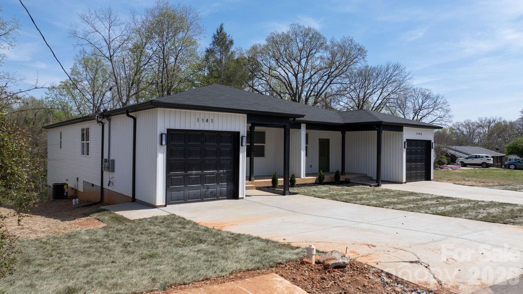 Front exterior of a new home in , Hickory, NC, highlighting curb appeal (Image 24).