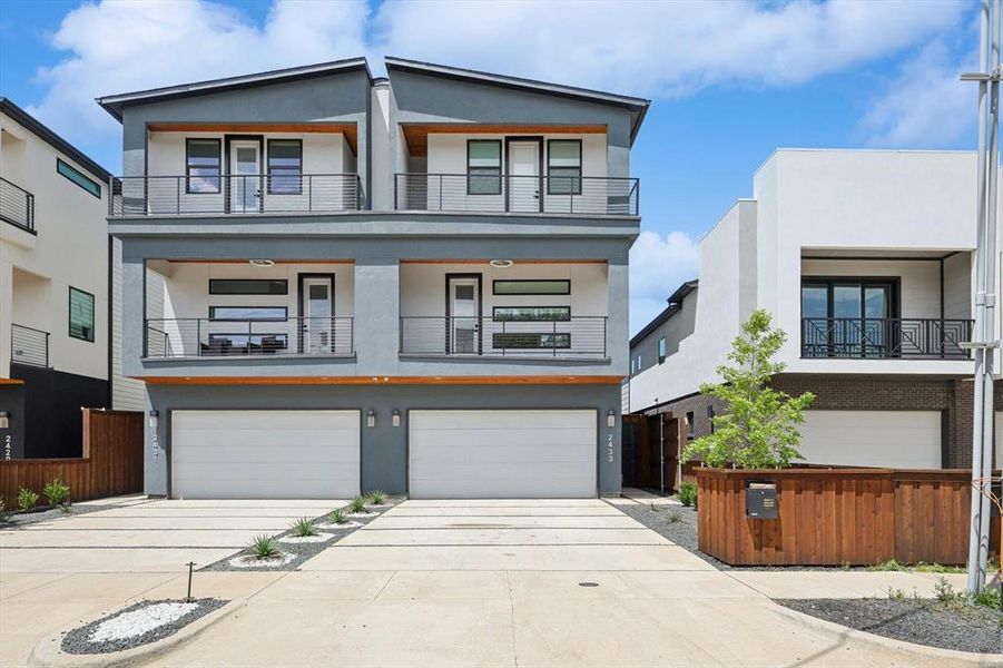 Contemporary house featuring a garage and a balcony