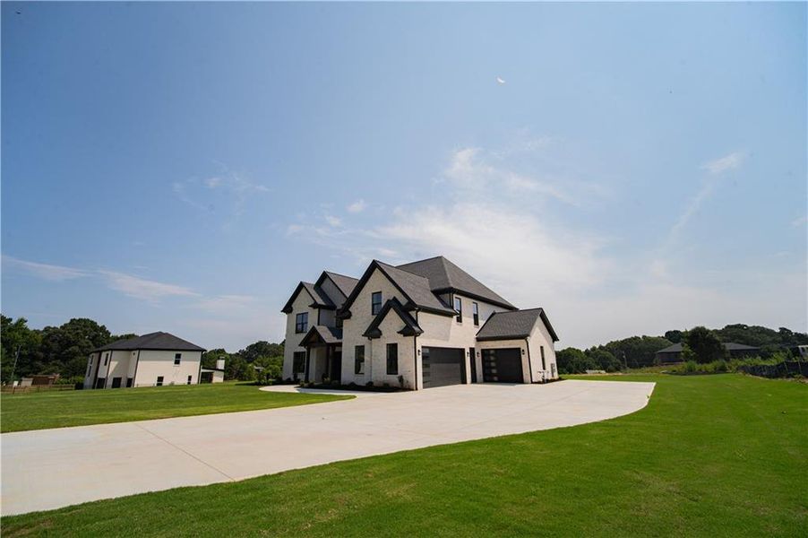 Front exterior of a new home in , Dacula, GA, highlighting curb appeal (Image 27). Front exterior of a new home in , Dacula, GA, highlighting curb appeal (Image 27).