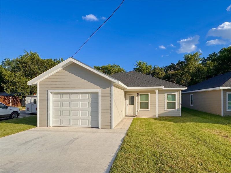 Single story home with a front lawn