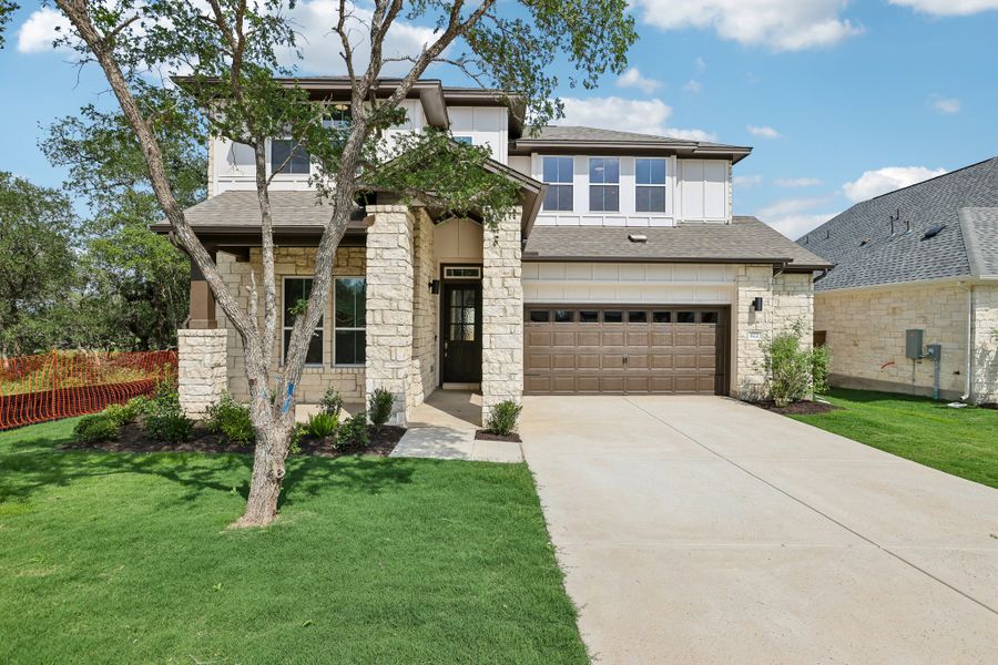 Front exterior of a new home in Persimmon, Buda, TX, highlighting curb appeal (Image 1). Front exterior of a new home in Persimmon, Buda, TX, highlighting curb appeal (Image 1).