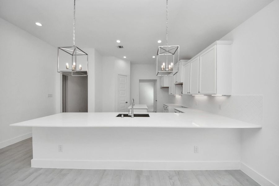 The extended counter area adds both practicality and style, making meal preparation a breeze. Every detail is thoughtfully designed to enhance the kitchen's functionality and aesthetic appeal.