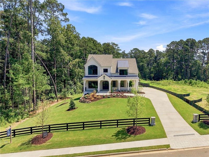 Front exterior of a new home in , Milton, GA, highlighting curb appeal (Image 34).