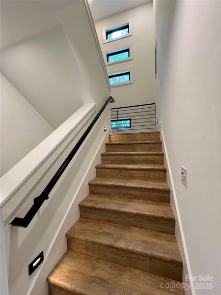 Stairway with steel railings, modern windows and path lights. Stairway with steel railings, modern windows and path lights.
