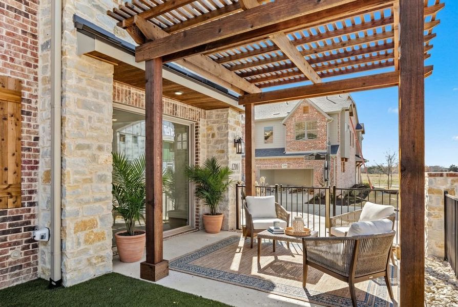 Exterior details and patio area of a home in The Tribute, The Colony (Image 25).