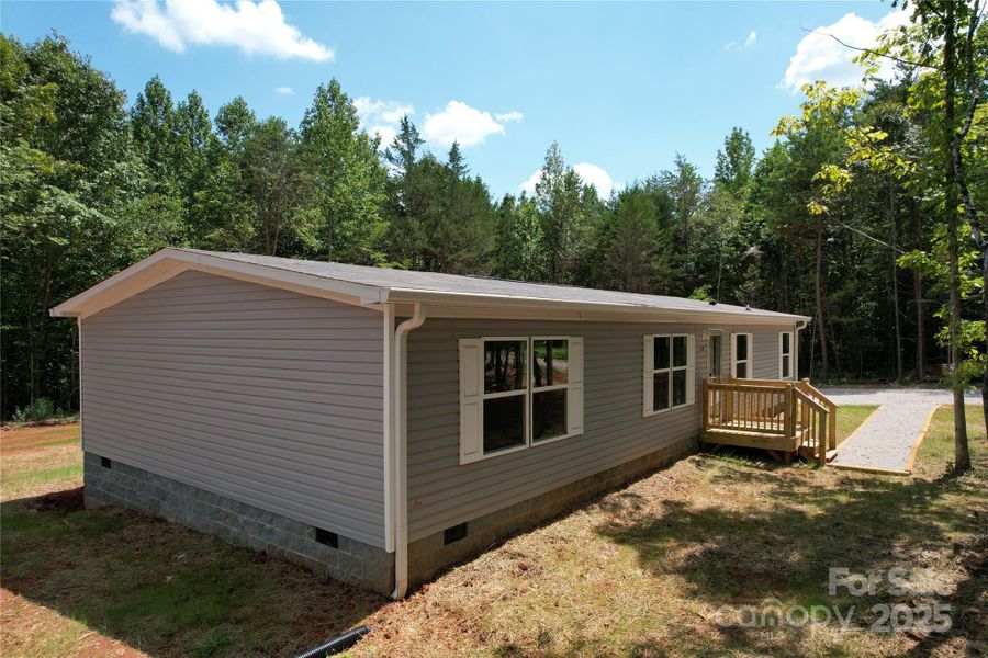 Front exterior of a new home in , Yadkinville, NC, highlighting curb appeal (Image 11).