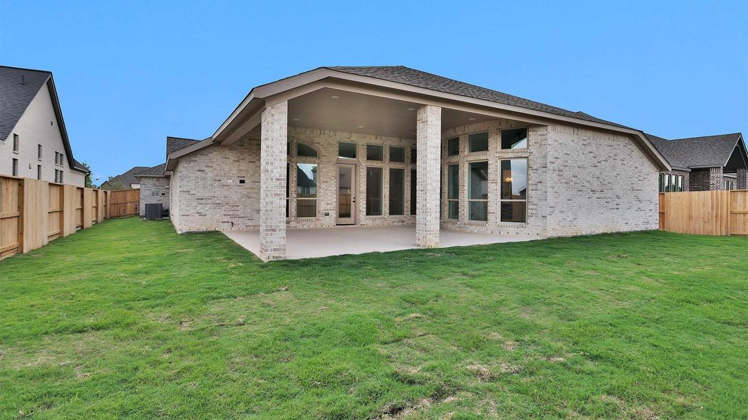 Exterior details and patio area of a home in Meridiana, Manvel (Image 3).