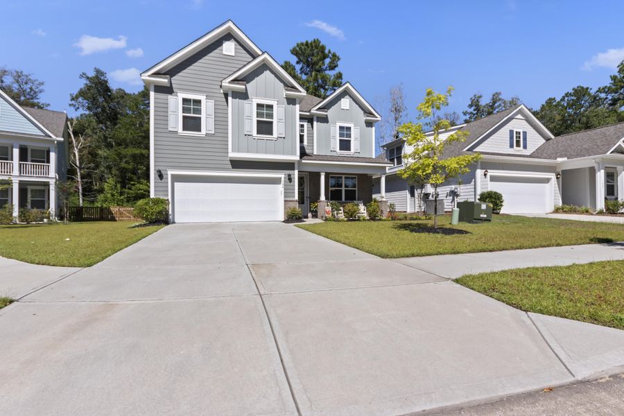Front exterior of a new home in The Ponds, Summerville, SC, highlighting curb appeal (Image 24).