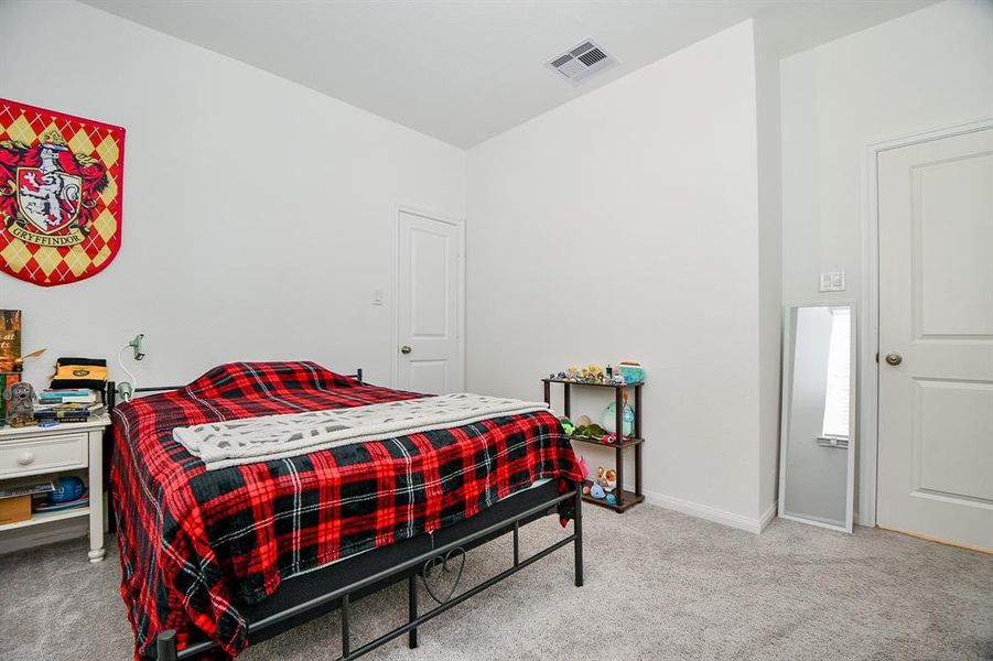 An alternate view of this guest bedroom shows ample space for furniture, games, toys and more.