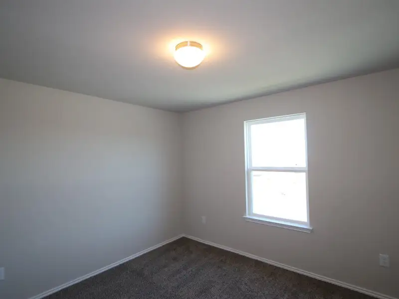 Spacious, unfurnished interior of a new home in Cascades at Onion Creek, Austin (Image 8).