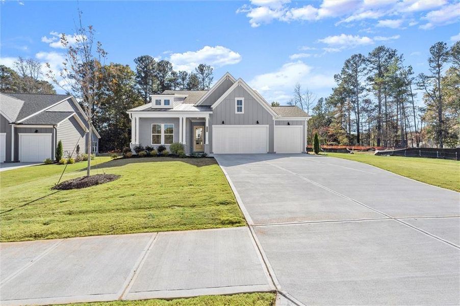 Front exterior of a new home in Hillgrove Preserve, Powder Springs, GA, highlighting curb appeal (Image 2).