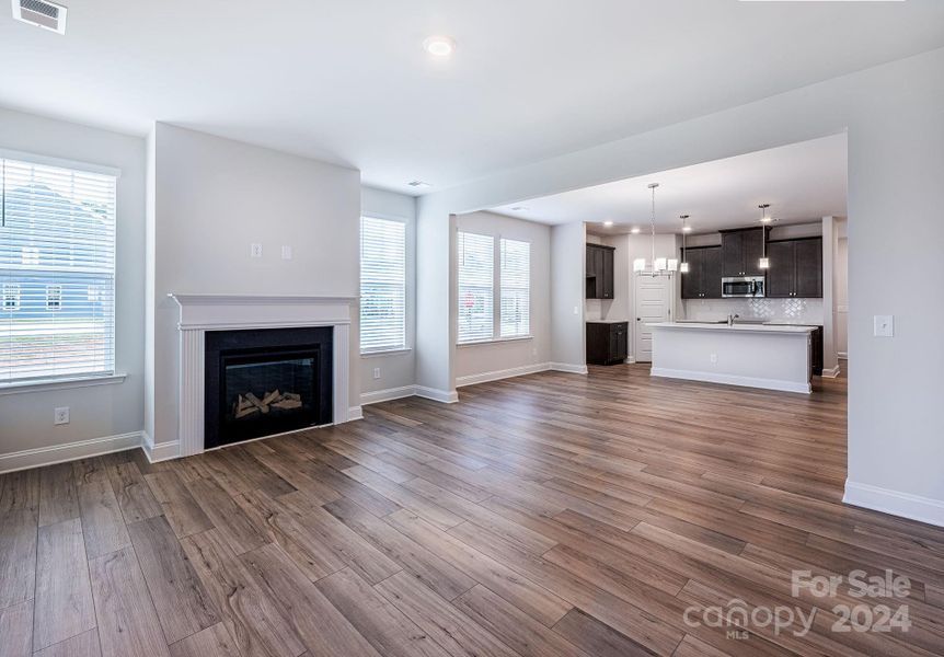 Open concept living room/dining/kitchen