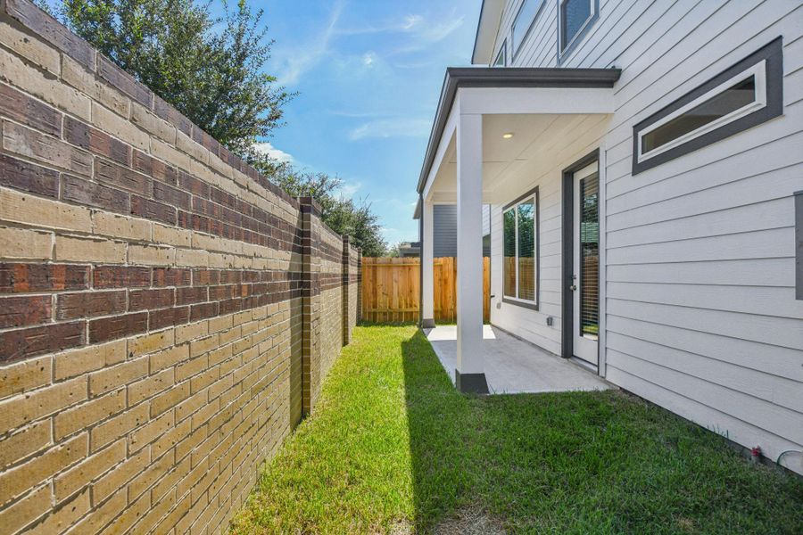 Exterior details and patio area of a home in Spring Brook Village - Luxe Series, Houston (Image 3).