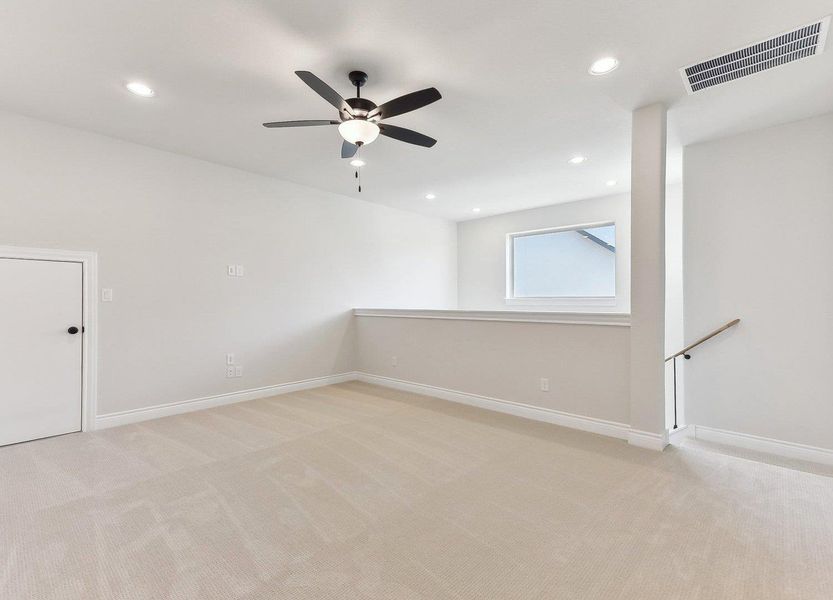 Empty room with light carpet, visible vents, and recessed lighting Empty room with light carpet, visible vents, and recessed lighting