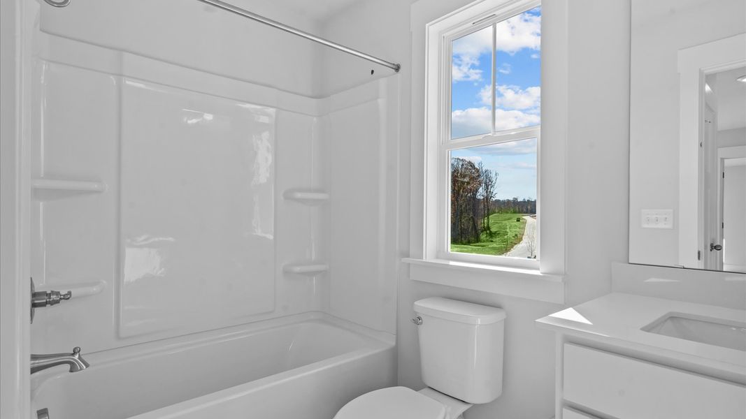 Elegant full bathroom with tasteful finishes and a thoughtfully designed layout