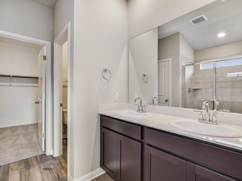 Furnished interior view inside a new home in Riverbend at Double Eagle - Reserve Collection, Cedar Creek (Image 3).