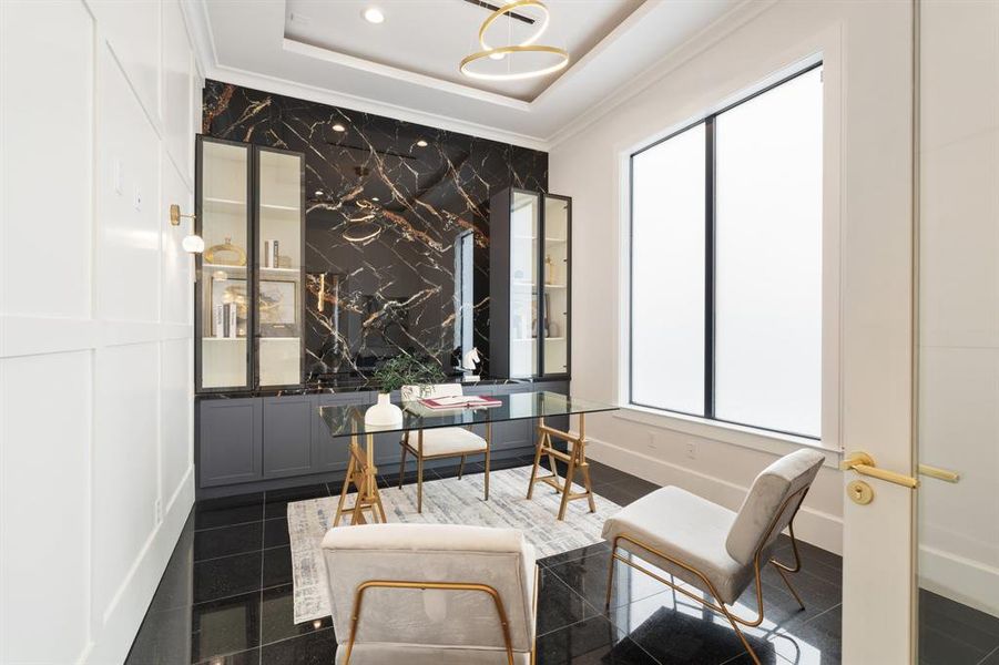 Elevate your workspace with custom cabinetry, marble-clad walls, and smart windows for privacy, creating a stylish and functional environment for working from home.