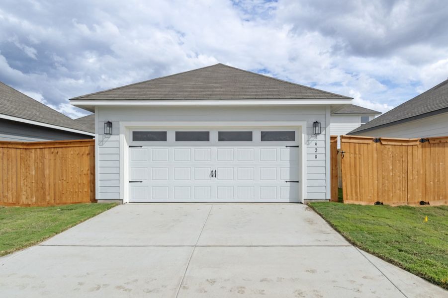 Front exterior of a new home in Trace, San Marcos, TX, highlighting curb appeal (Image 30).
