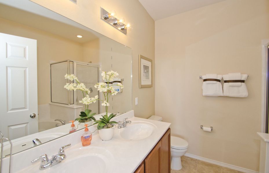 Owner's bathroom featuring tile floors