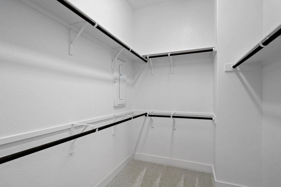 Walk-in closet in Primary Bedroom Walk-in closet in Primary Bedroom