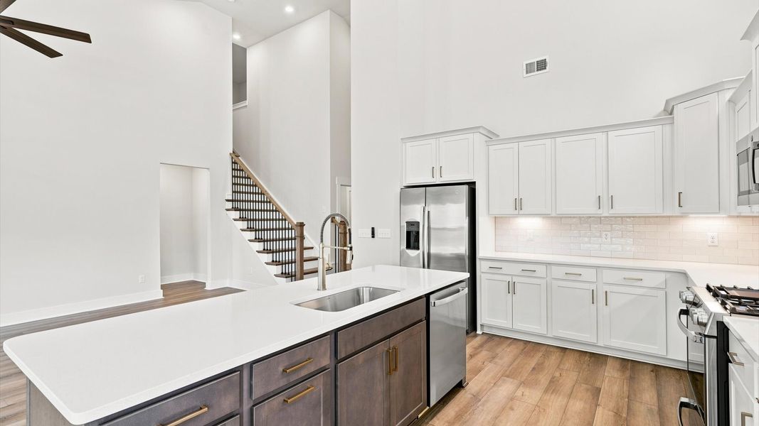 Tasteful kitchen with oversized island and high ceilings—crafted to high standards located in Spartanburg, SC