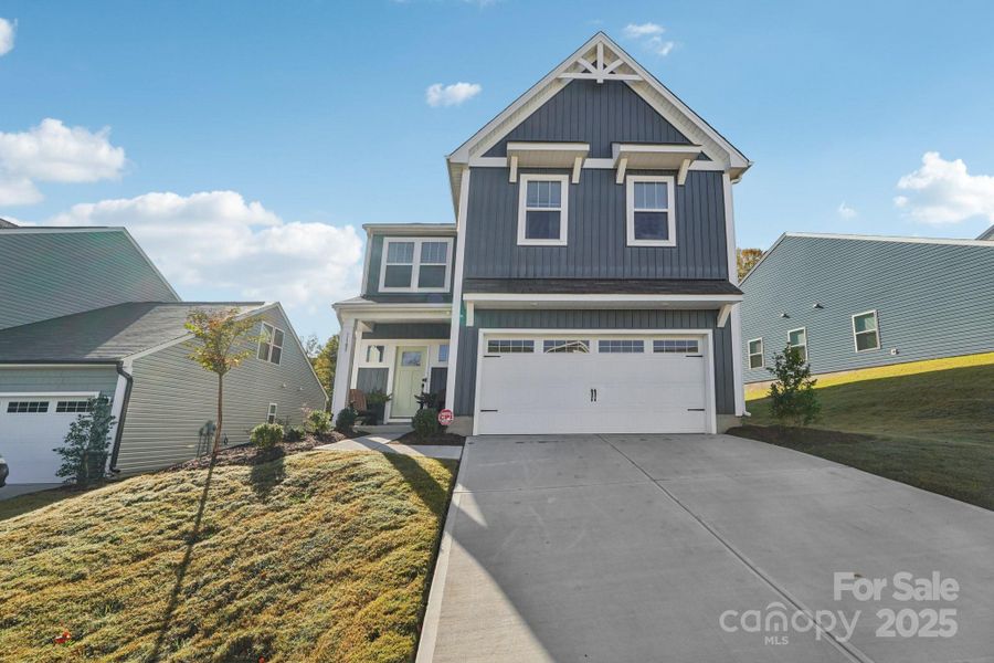 Front exterior of a new home in Lowell Woods, Lowell, NC, highlighting curb appeal (Image 2).