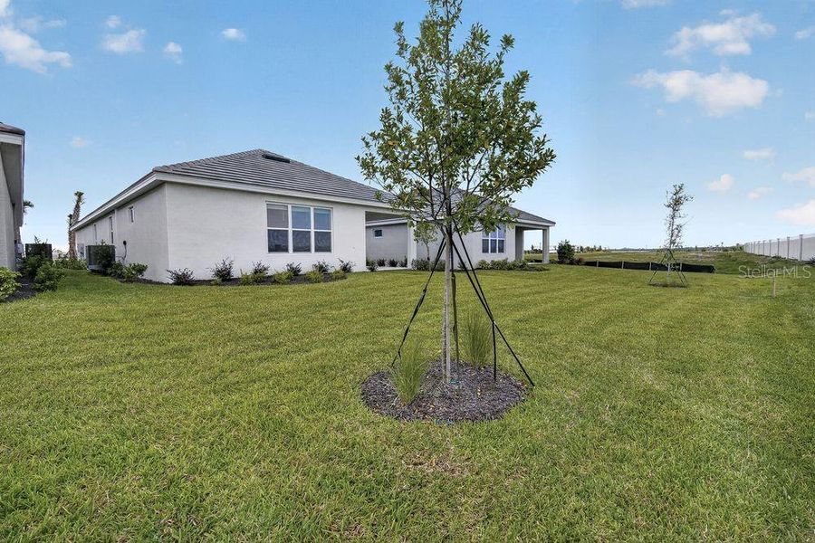 Exterior details and patio area of a home in Coasterra Community Group Page, Palmetto (Image 17).