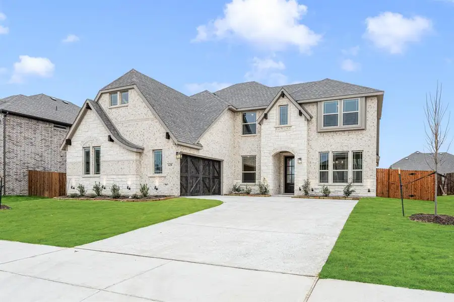 Front exterior of a new home in Sunrise at Garden Valley, Waxahachie, TX, highlighting curb appeal (Image 26).