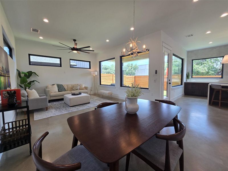 Set up the living space as you wish - lots of space for dining, living, or play areas. Lots of windows throughout, uppers for light and privacy from neighbors, and huge windows to your back yard.