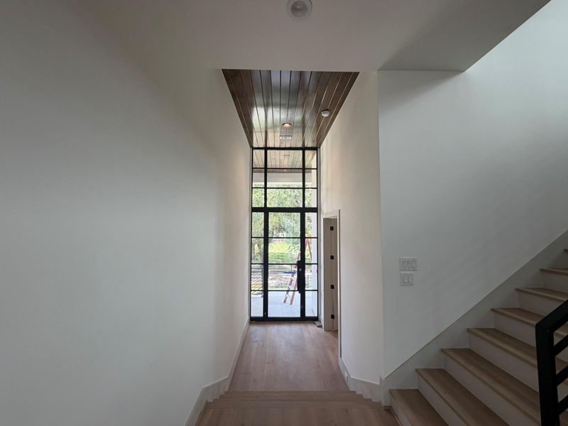 The formal entry is accented by tounge and groove wood ceilings flowing cleanly from the front porch to the entry. Anderson doors and windows throughout the homes.