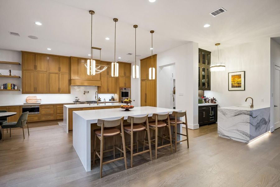 Another view of the kitchen, looking toward the open bar and adjacent working pantry.