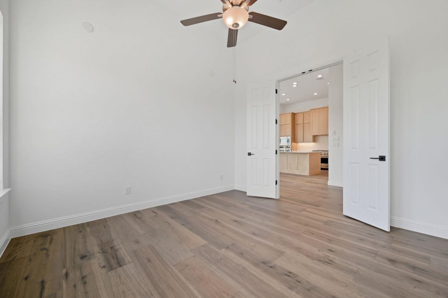 Unfurnished room with light wood-style flooring, recessed lighting, and a ceiling fan