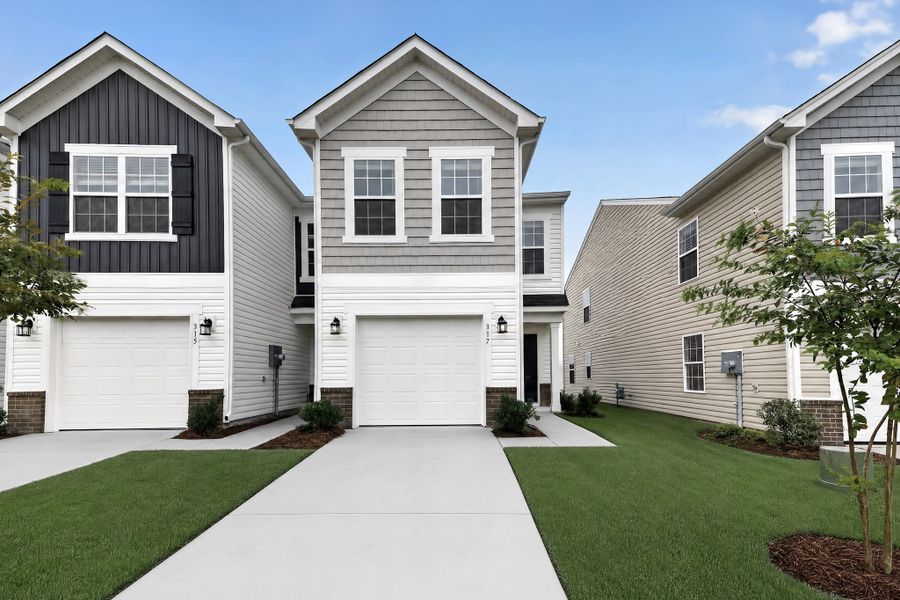 Front exterior of a new home in Taylor Hill, Gilbert, SC, highlighting curb appeal (Image 1). Front exterior of a new home in Taylor Hill, Gilbert, SC, highlighting curb appeal (Image 1).