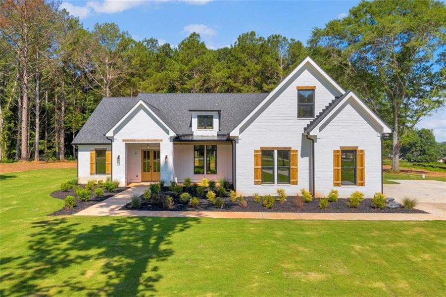 Front exterior of a new home in , Covington, GA, highlighting curb appeal (Image 26). Front exterior of a new home in , Covington, GA, highlighting curb appeal (Image 26).