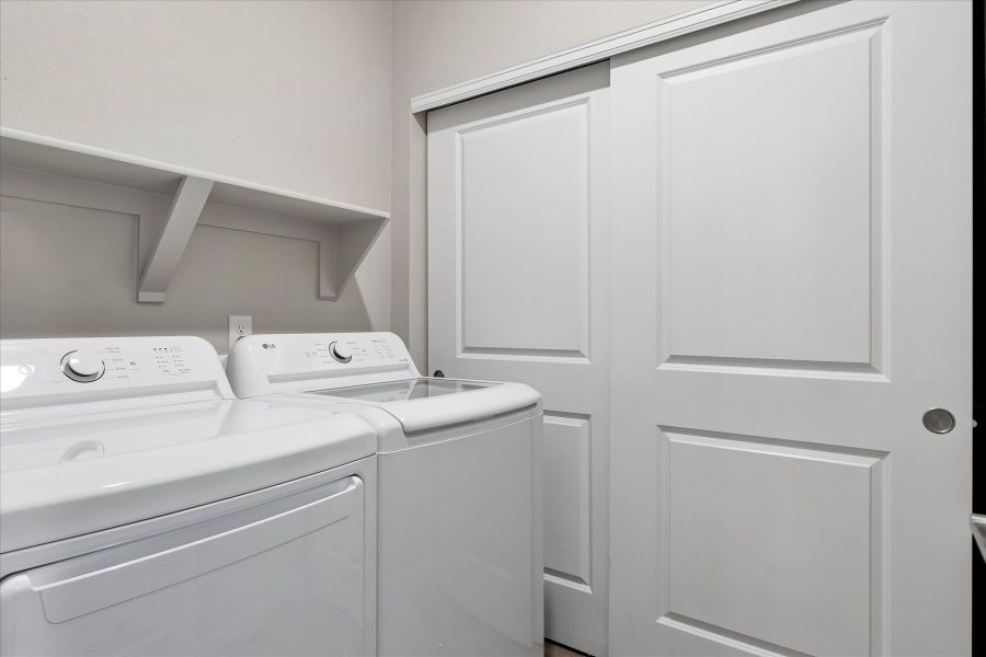 A white kitchen with white cabinets.