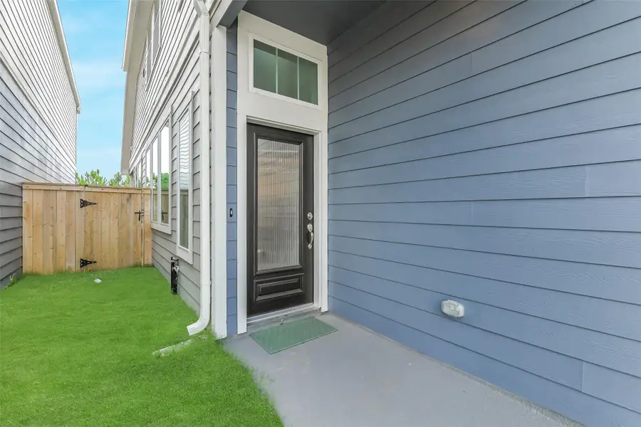 Exterior details and patio area of a home in , Cypress (Image 3).