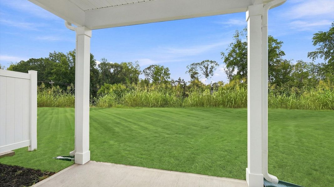 Exclusive rear covered porch with accomplished detail and elevated outdoor living potential by DRB Homes