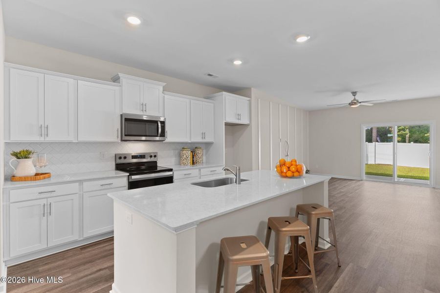 Furnished interior view inside a new home in Coastal Haven Townes, Leland (Image 3).